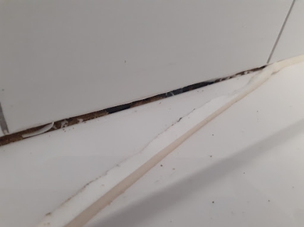 This old shower silicone seal was not properly attached to the...