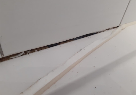 This old shower silicone seal was not properly attached to the...