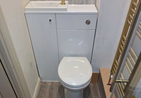 This combined wash basin and toilet unit was installed for a...